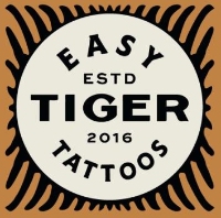 Brands,  Businesses, Places & Professionals Easy Tiger Tattoo in Edmonton AB